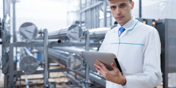 technologist-white-coat-with-tablet-his-hands-controls-production-process-dairy-shop-quality-control-dairy-plant